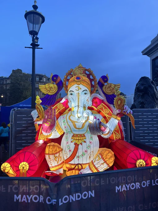 An icon of the Hindu God Ganesha is radiant in the evening light