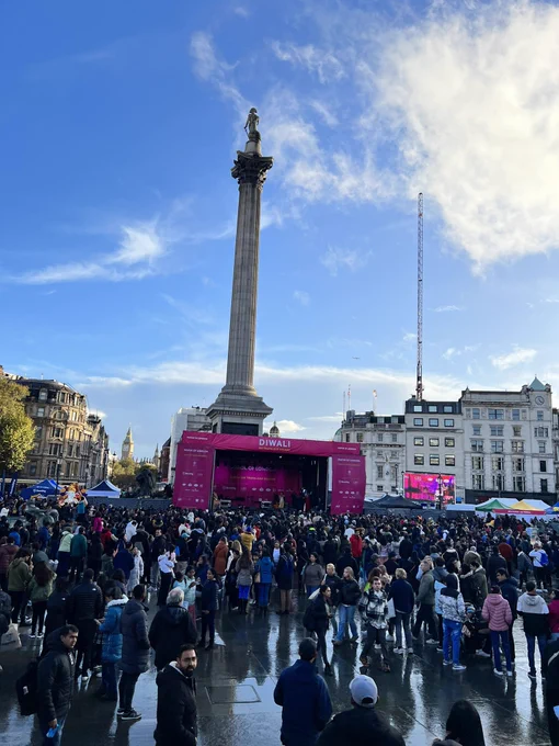 A huge crowd of people stand in front of Nelson’s column in Trafalgar Square celebrating Diwali