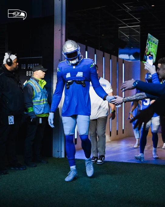 DK Metcalf taking the field in his Throwback jersey.