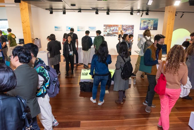 People attending the opening event of #visap2023 at the Library at the Dock in Melbourne
