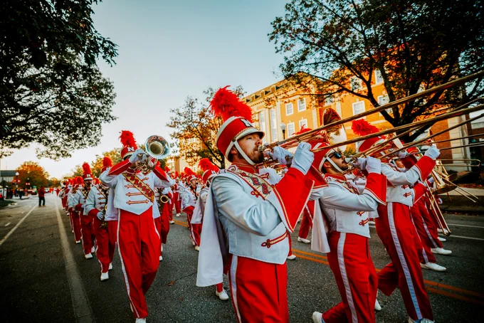 The Cornhusker Marching Band marches down R Street to begin the parade.