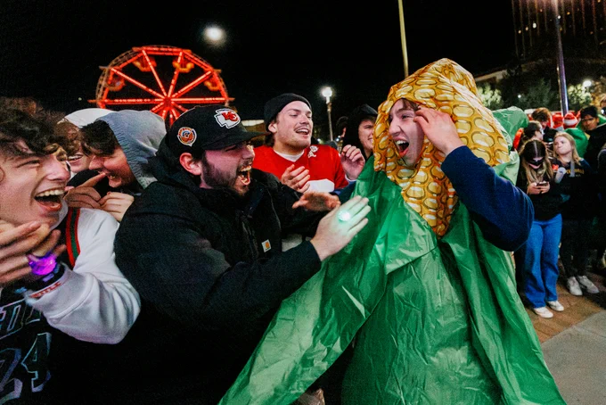 James Lynch with Phi Kappa Psi is mobbed by his friends after winning the jester competition