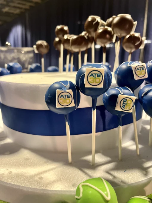 A photo of cake pops with a logo for ATE 30