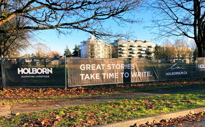 Picture of the empty site at Little Mountain, with a Holborn developer sign that says "Great stories take time to write."
