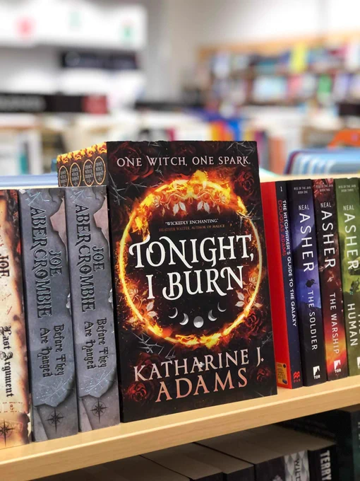 Tonight, I burn on the bookshelf between Joe Abercrombie and Douglas Adams!