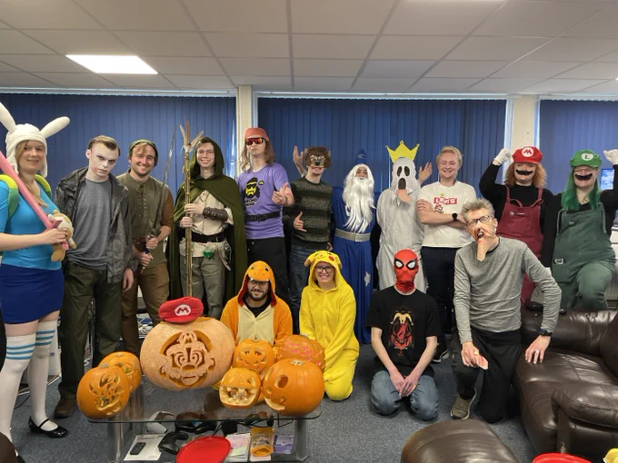 A group photo of some of our staff dressed as characters such as Mario, Luigi, Spiderman, Pikachu, Charmander, Merlin, Link and many more.