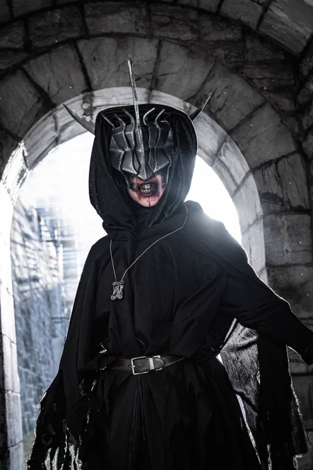 Handmade costume of the Mouth of Sauron from The Lord of the Rings, in front of a stone archway