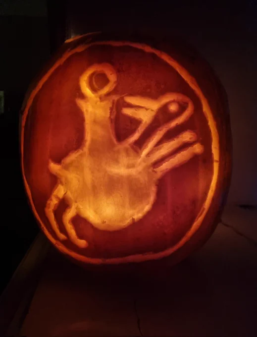 Pumpkin carved with hare and bottle