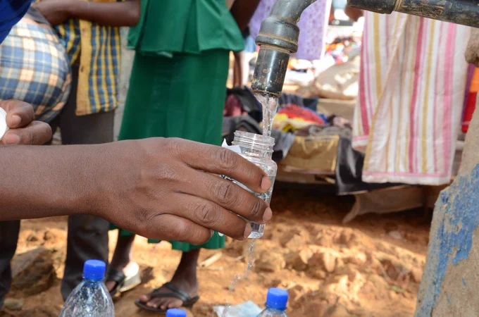 What’s in the water? Collecting a sample to test for E. coli from a water kiosk in Kitui County, Kenya. (Image by Saskia Nowicki)