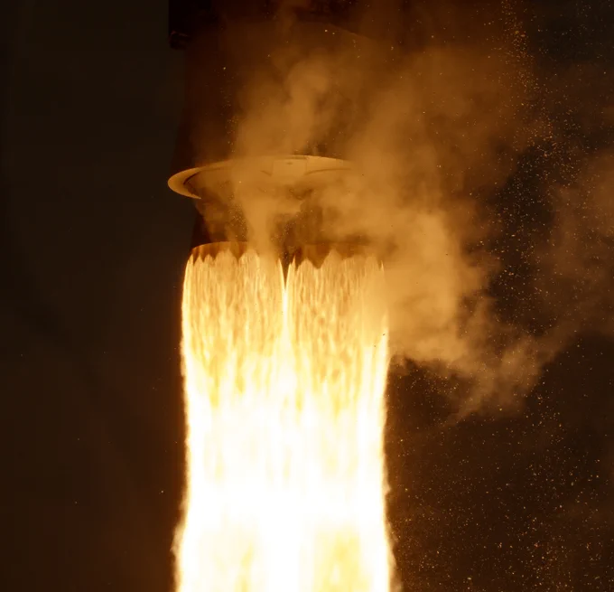Closeup shot of fiery rocket exhaust, moments after liftoff.