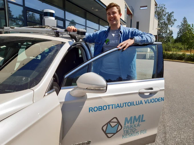 Antti Regelin, student of Automation and Control Engineering and FGI's autonomous road mapping car.