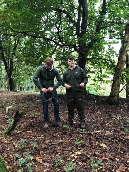 Tidy work: Tristan and Iwan salvaging tensioning wire. 