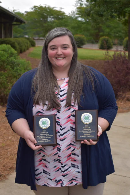 Ashley Carroll displays her two awards

