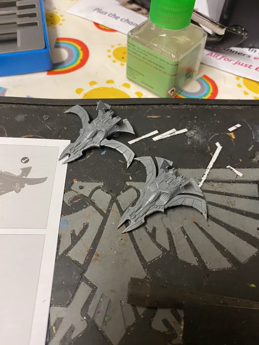 Two very small plastic model fighter jets.
