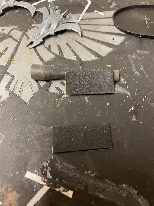 Some foam and rubber arranged to make a crude cradle.