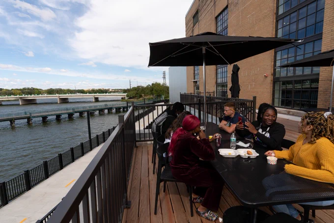 Students enjoy a patio at the Beloit College Powerhouse.
