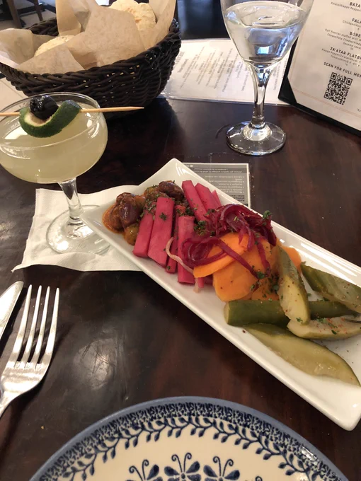 Marinated veggie pickles and written word cocktail.