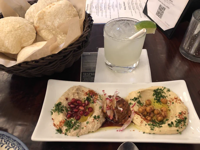 Puffy pita bread, baba ghanoush, and hummus with a spicy margarita.