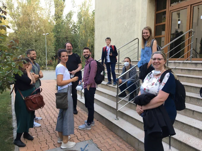 An informal group photo of BioCombs4Nanofibers 2nd plenary meeting participants in front of the library at Magurele campus. 
