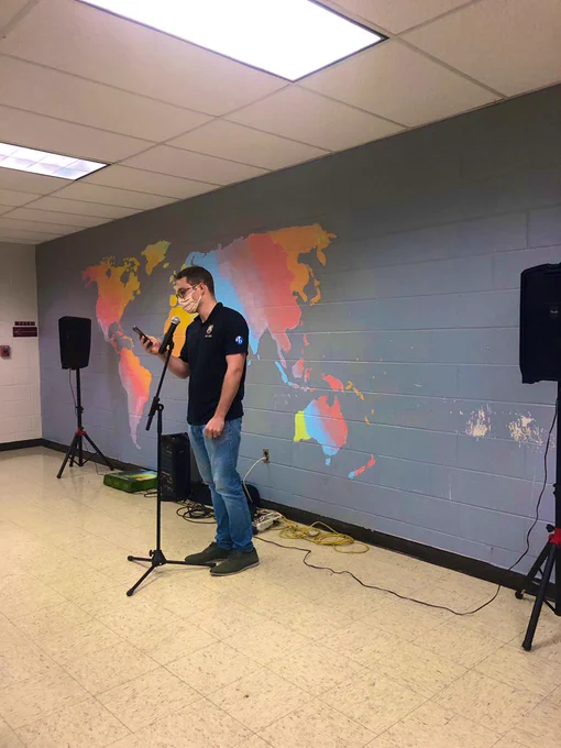 Chorus Director Mr. Mann tells jokes at Open Mic