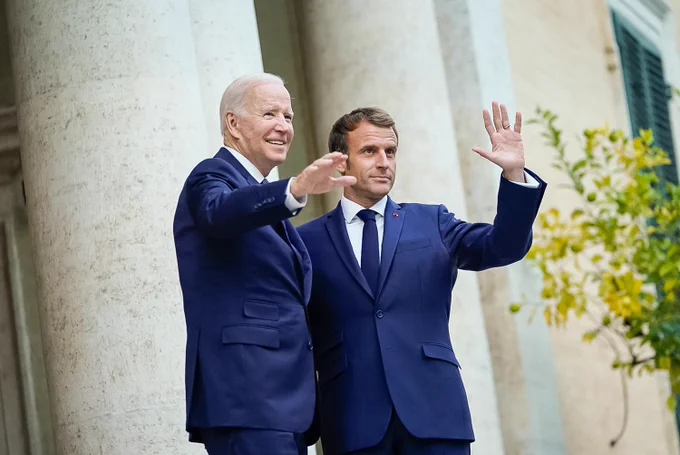 President Biden waves with French President Emmanuel Macron