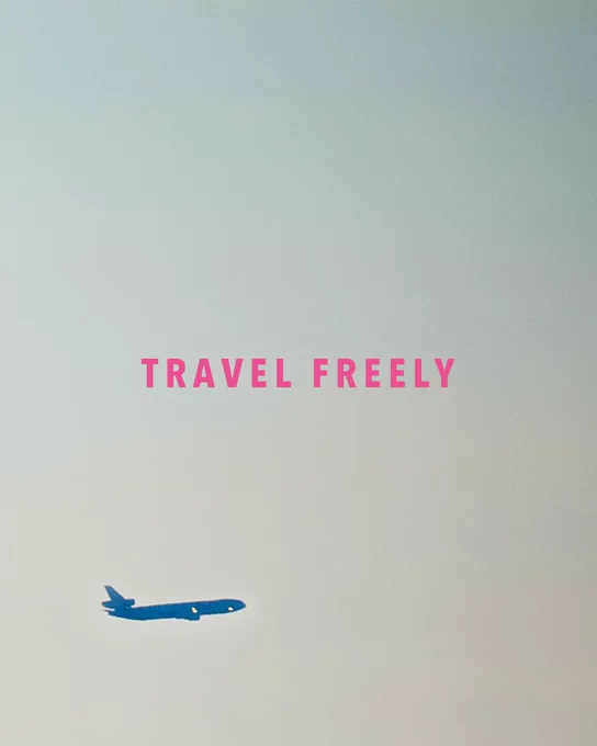 Plane flies through the frame and accompanying text says "Travel Freely: 