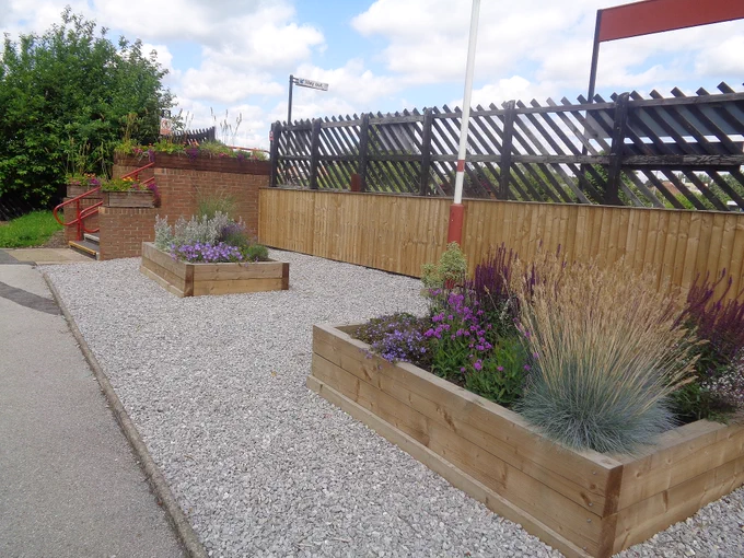 Raised flower beds on the station approach.