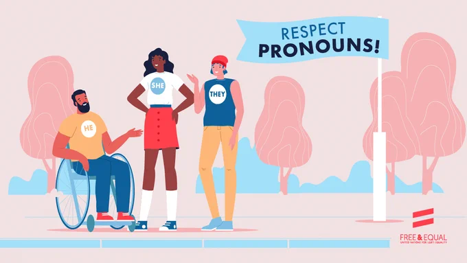 3 people with various appearances are wearing t-shirts with their pronouns: "he", "she" and "they"; behind them is a large flag with the text "Respect pronouns"