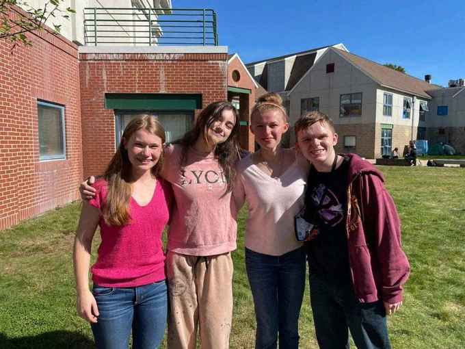 Seniors Meghan Andrews, Amelia Franklin, and Morgan Beck pose with Junior Aidan Thornton for Pink Out Day, EWG Senior High's Spirit Week opener.
