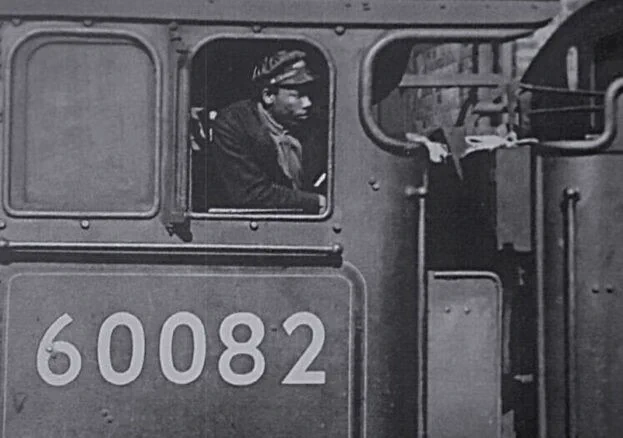 Wilston Samuel Jackson in the cab of a locomotive.
