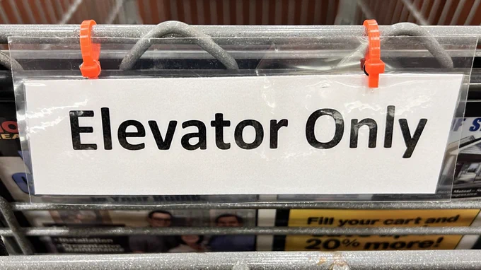 The third sign reads “elevator only “