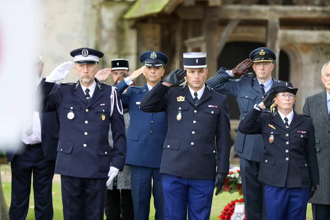 Image shows personnel attending the memorial service.