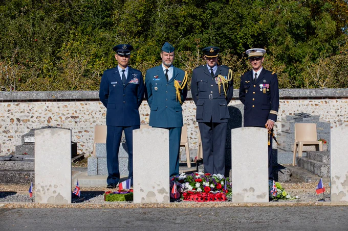 Image shows personnel attending the memorial service.