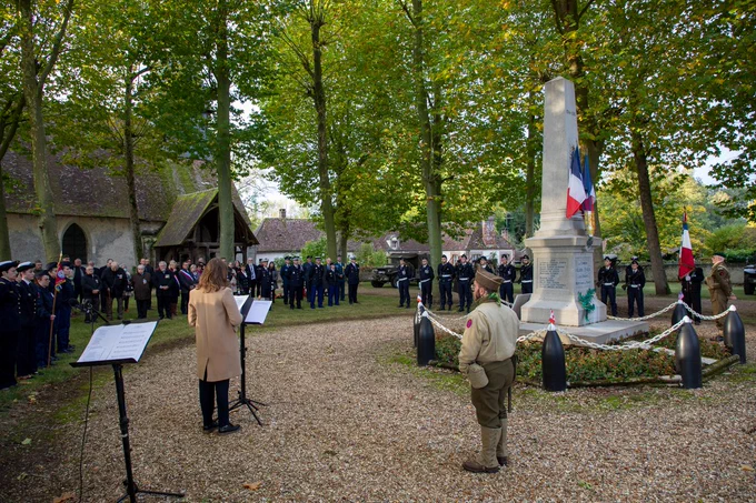 Image shows personnel attending the memorial service.