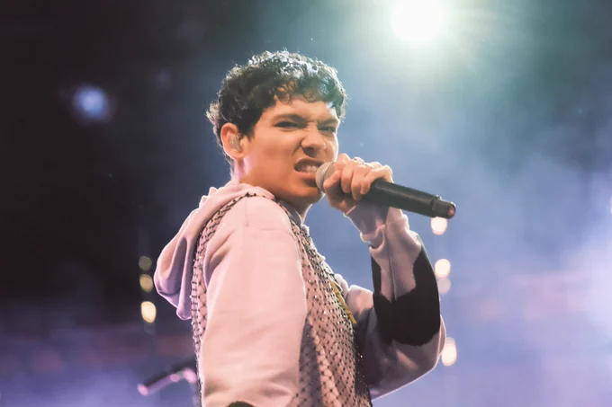 Omar Rudberg shows a face of disgust towards the camera while performing