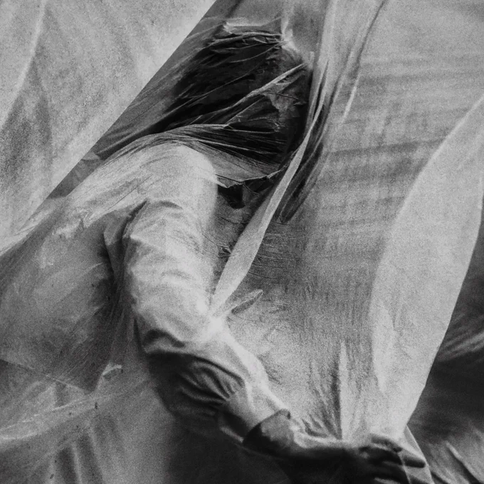 A black and white image. The Man (He does not know his name) in the grip of the nightmare.