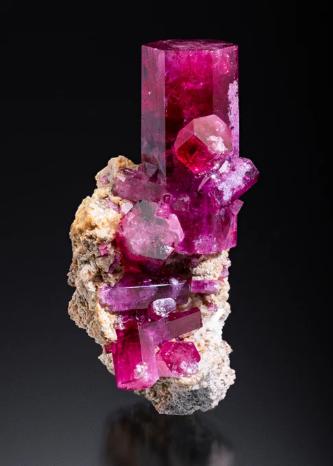 Red Beryl placed on black background.
