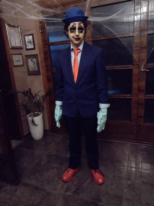 A man dressed as the titular character from the videogame Horace (2019) stands with his arms by his side.