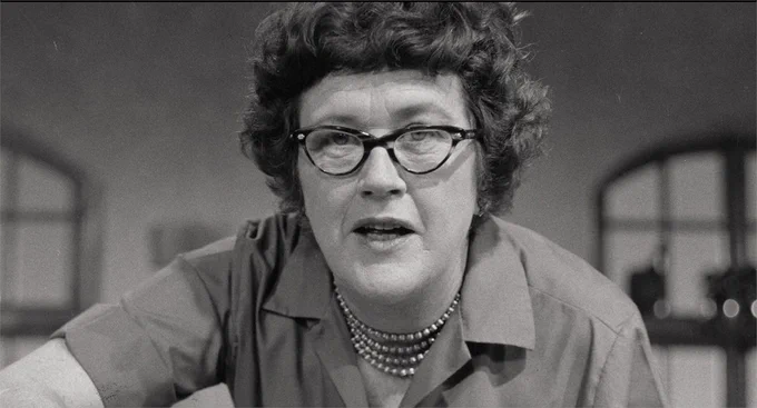 Archival image of Julia Child looking straight-to-camera as seen in the new "Julia" documentary. 