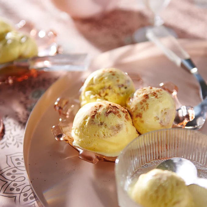 a bowl of 3 scoops of eggnog ice cream