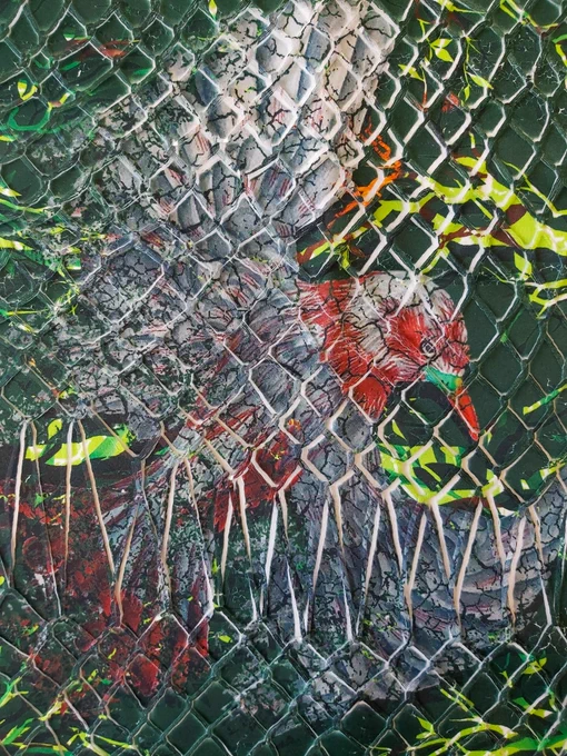 Penfia Rodrigues
ID: A close up image of a dark green coloured fabric printed with bright greens, oranges, browns and reds. A large bird design is central to the image with a mesh wire pattern overlaid.