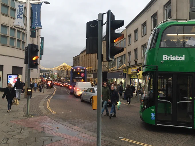 A variety of buses stuck in traffic congestion.