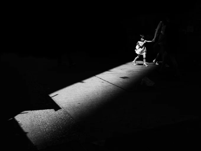 Cris Batula: Emphasis using light created a narrative with deeper meaning to an otherwise ordinary scene. Without the light pointing the way, the story in the photo will never come to life.