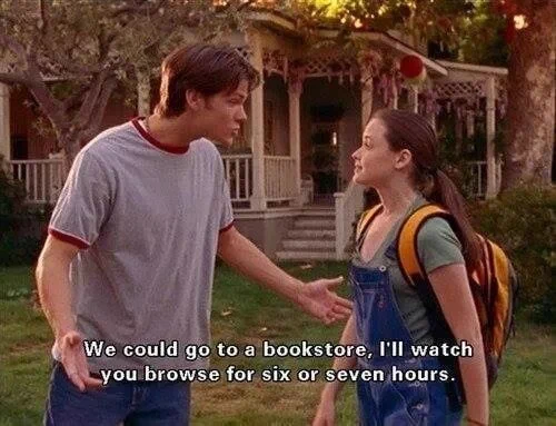 Screencap from Gilmore Girls with Dean talking to Rory saying "We could go to a bookstore, I'll watch you browse for six or seven hours.⁠