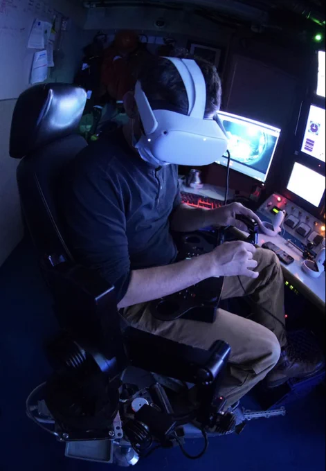 Pilot and Engineer Ben Erwin controls the ROV’s robotic arm using a stereo headset connected to our 3D VR camera, which is down at a depth of 3070 meters. The arm was equipped with a special water-jet-cut grasper designed by Randy Prickett not to crush the mammoth tusk as it was gently placed on the sample drawer. @MBARI_News