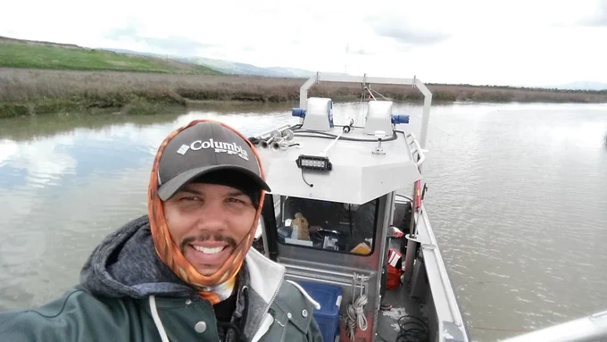 Photo of Dr. Levi Lewis on a research vessel.