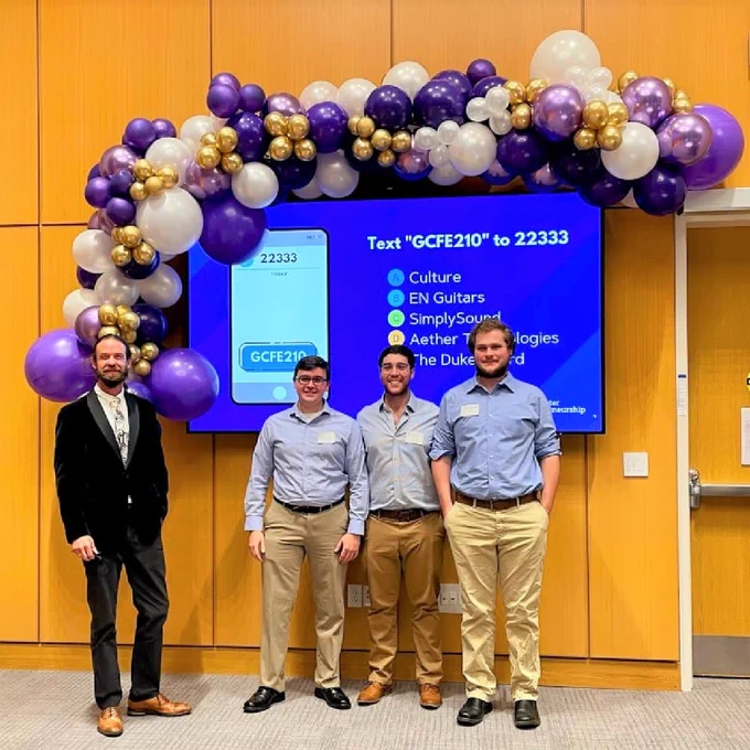 Christian Bowman, Zane Luker, and William Connor posing for a photo with their academic advisor, Chris Bachmann