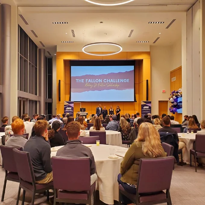 Audience sitting in the Hartman Hall Forum, listening to the Fallon Family explain the Fallon Challenge on stage