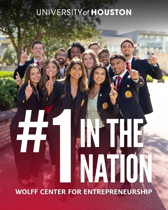 Image showing a dozen Wolff Center students standing together outside holding up their index fingers with large text at the bottom saying "#1 in the Nation"
