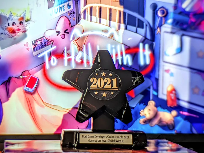 Goty trophy over a background of To Hell With It's title screen